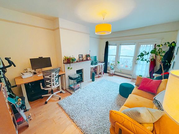 Sunny Living Room Space with Direct Outdoor Access to Newly Remodeled Yard and Private Patio Deck!