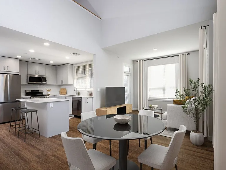 Kitchen, dining, and living room with hard surface flooring