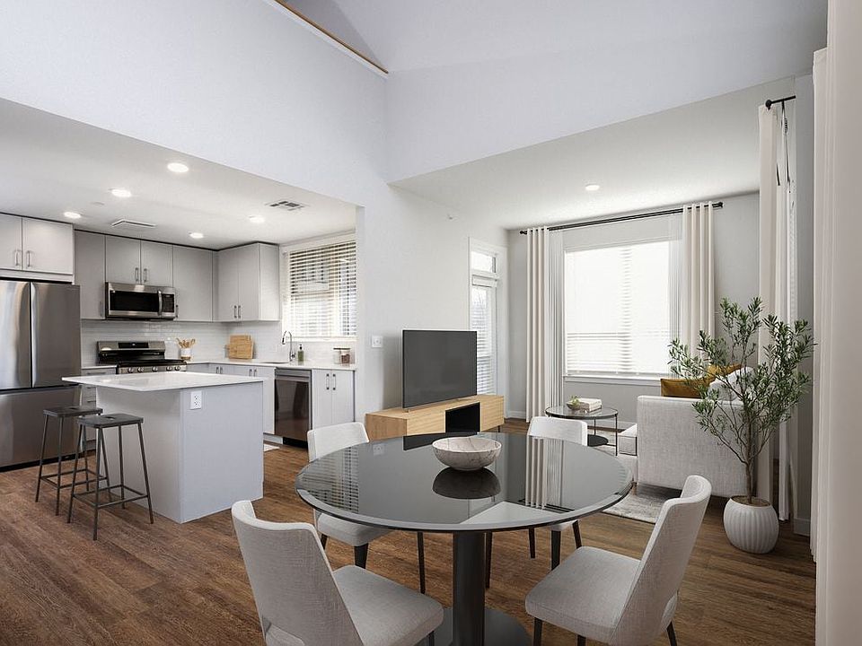 Kitchen, dining, and living room with hard surface flooring
