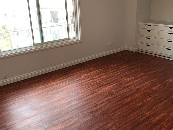 Master bedroom (@ 15' x 12.5') facing west with wall to wall closet, eight drawer dresser and private bathroom