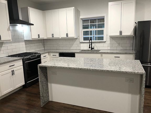 Large island allows for seating and extra cabinet space