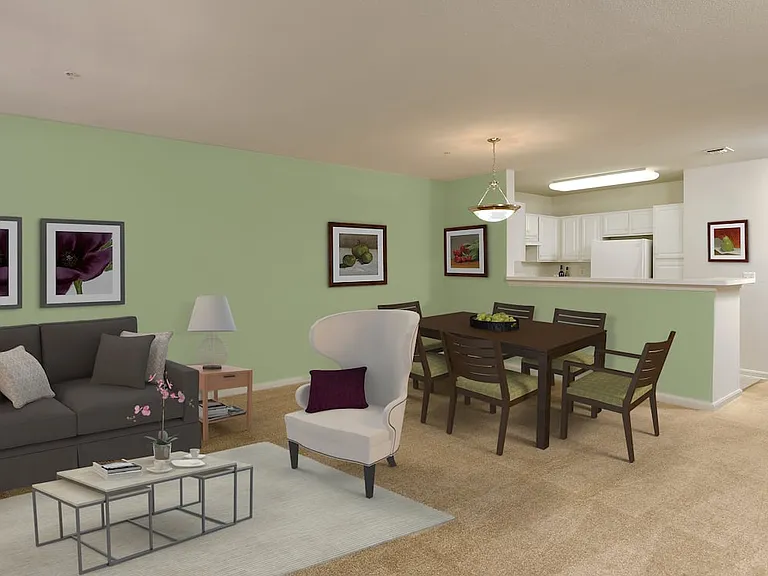 Classic Package kitchen, living, and dining area with white cabinetry, light laminate countertops, white appliances, and vinyl tile flooring with carpeting in common areas
