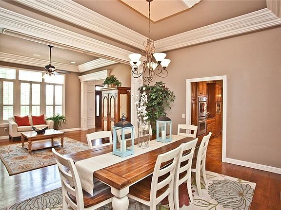 Formal Dining room with elegant crown molding.