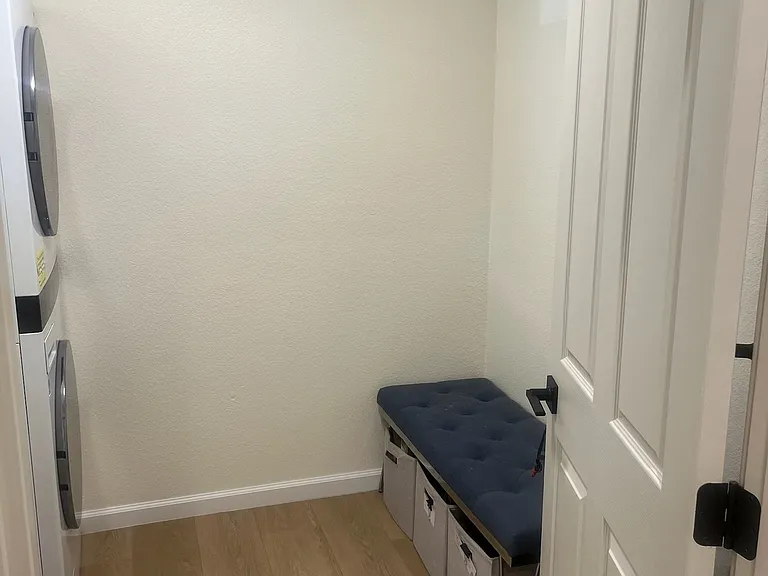 Laundry next to entryway.