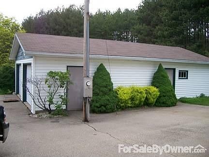 Detached two car garage
						:
						Landscaping on east side of 2 stall garage
