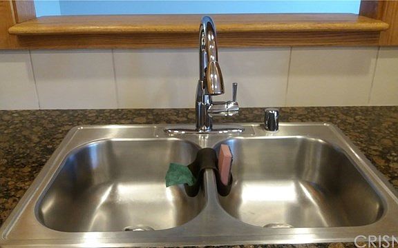 Stainless steel sink, granite counter top.