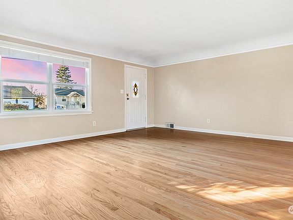 Looking back at front door,  notice that the home has central air heating.>