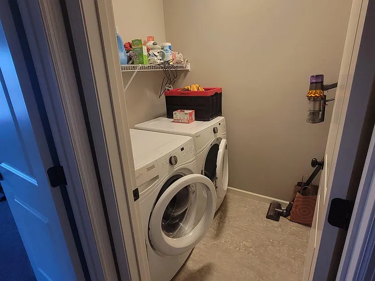 Washing machine / Dryer room next to master bedroom