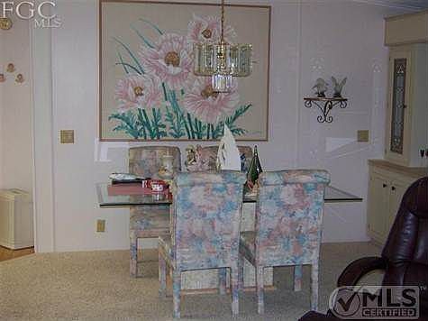 Nicely appointed dining room with dining room chairs that match great room fabric!  Nice touch!