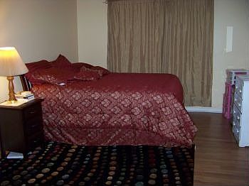 main bedroom. closets on opposite wall