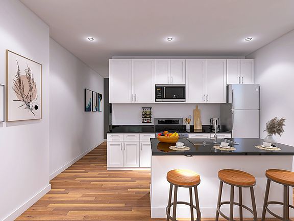 Kitchen Features include: New Stainless Steel Appliances with black granite countertops, Shaker style cabinets.