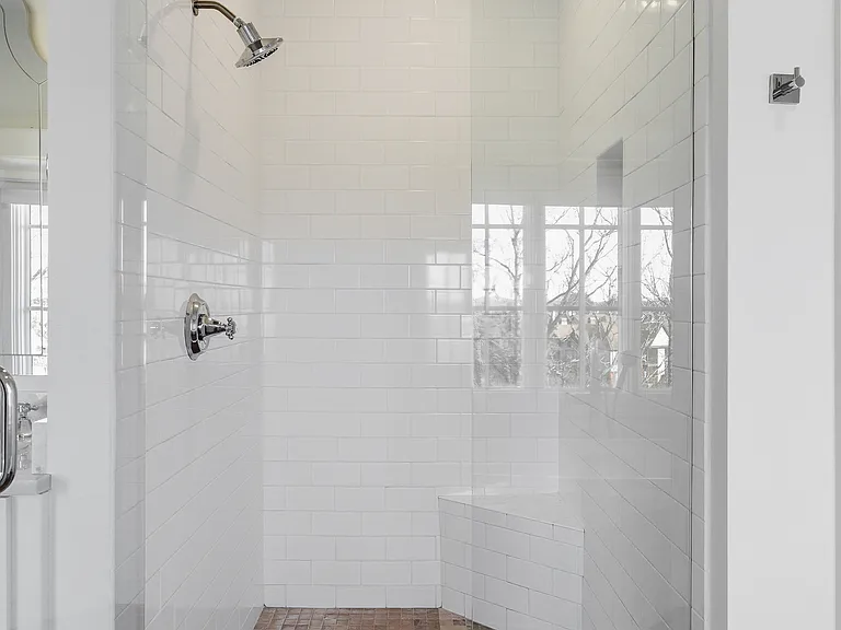 Full Bathroom connected to bedroom 1 with double vanity, shower, and large bathtub.