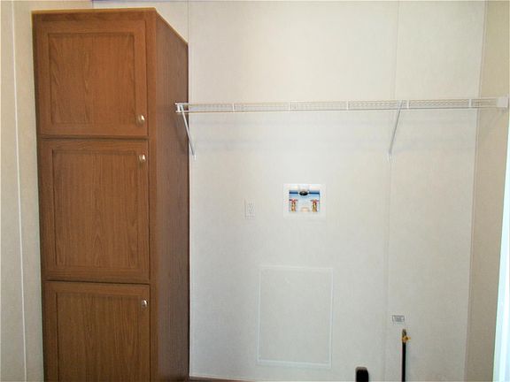 Laundry/mud room with cabinets and shelving!