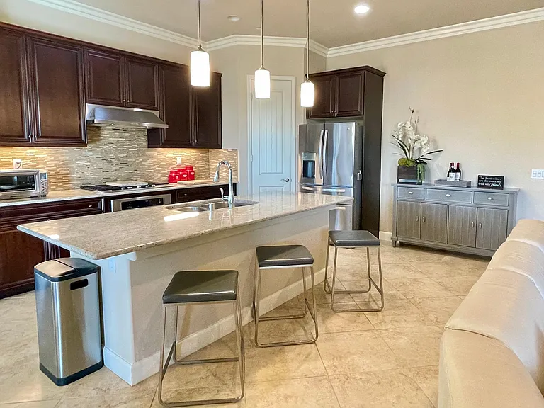 Chef's kitchen featuring quality stainless appliances all topped with beautiful granite counters and 3-4 counter stools for informal dining or distracting the cook!