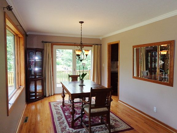 Closer view of the formal dining room with a door accessing the side deck.