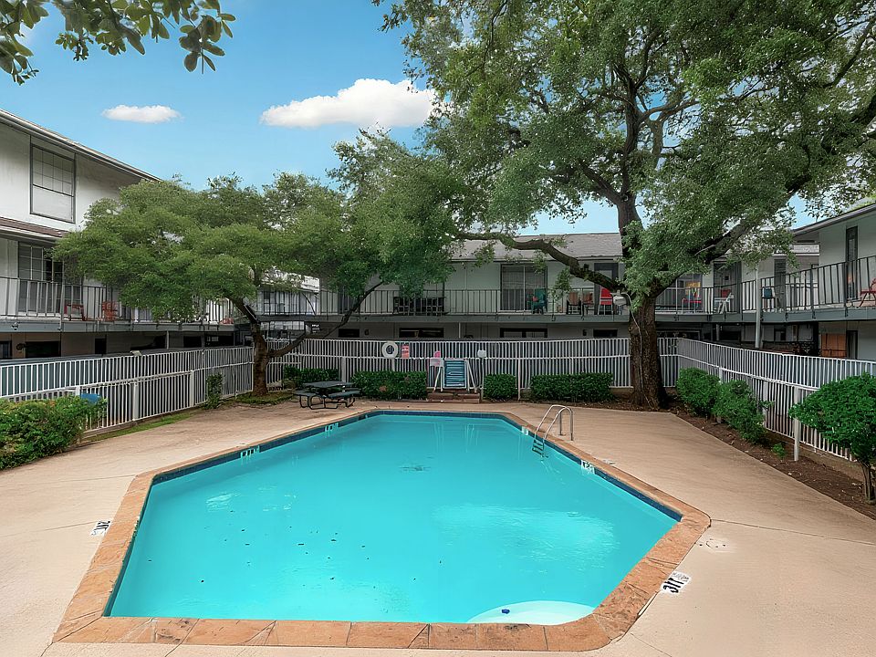 Take advantage of the community pool, surrounded by shade trees and lounge seating. A refreshing spot to relax during your stay.
