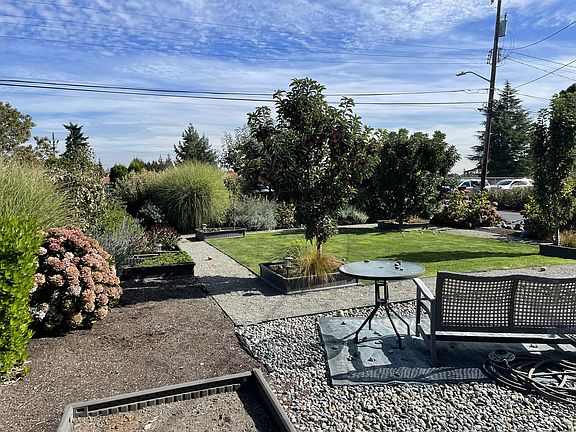 Front yard facing east to Holy Family School playground Traffic is very light on 21st Ave SW as it is not a through street