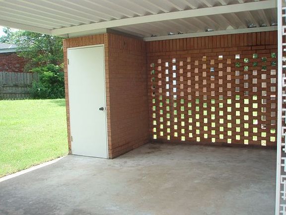 Covered Back Patio and Brick Storage Building