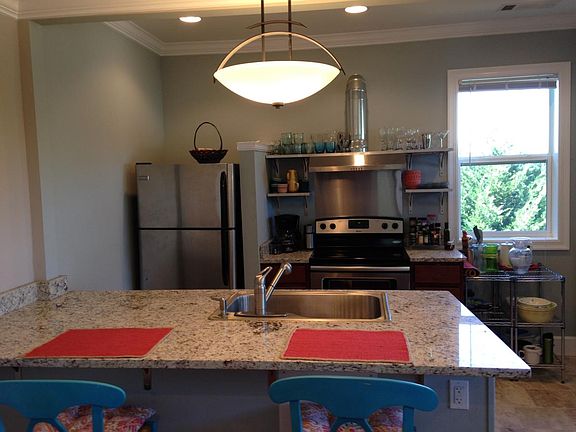 Open kitchen, granite counter w/ bar seating