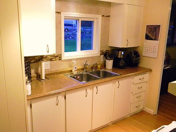 New countertop, sink, faucet, tile backsplash 