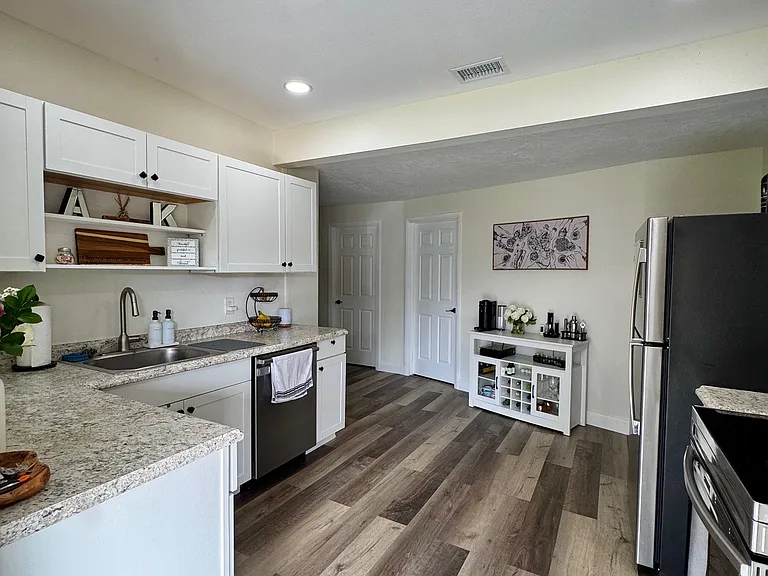 Kitchen with stainless steel appliances, including dishwasher