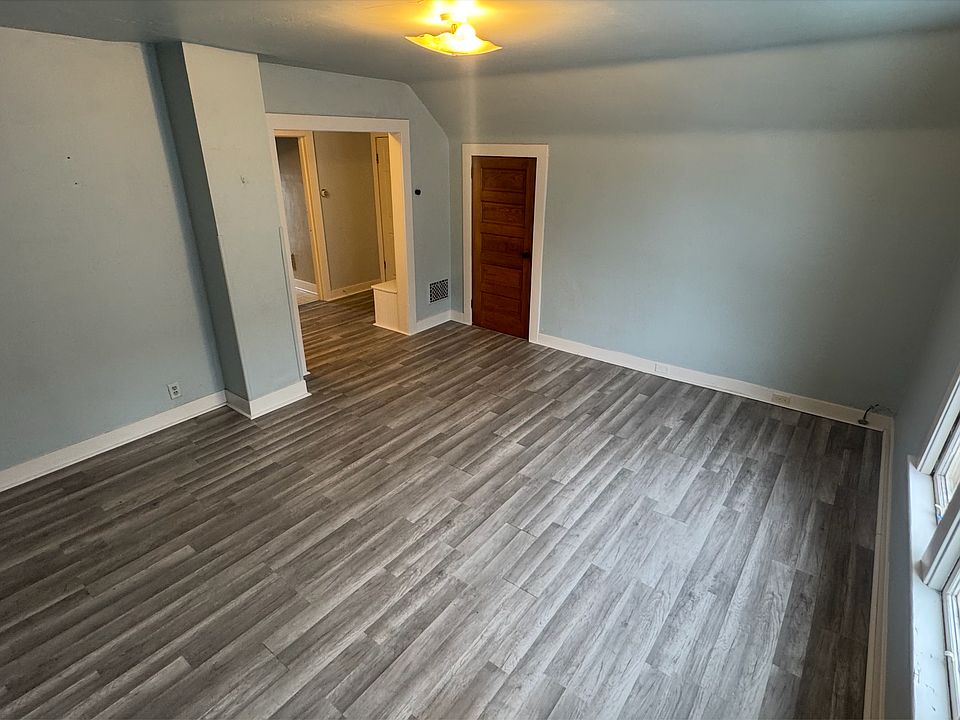 Large living room, store areas on either side