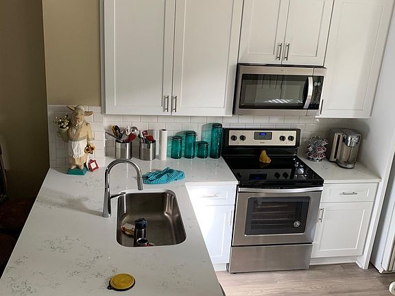 Kitchen totally renovated in 2019. New appliances stainless stove, microwave and dishwasher. Quartz countertops. Hickory wood floors throughout downstairs.