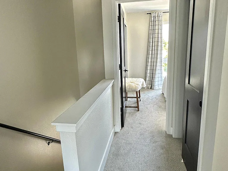 Carpeted stairs and hallway, dimmable canned lights