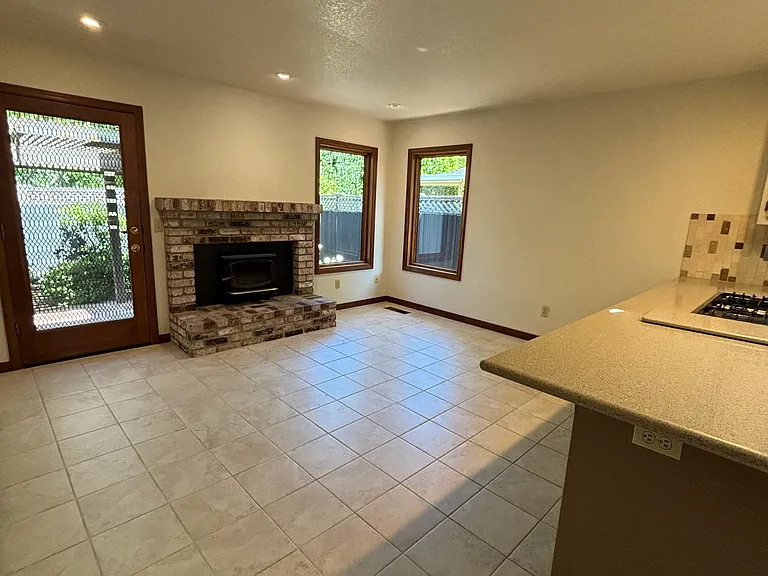 Family room/dining area that steps out to back patio dining/lounge area