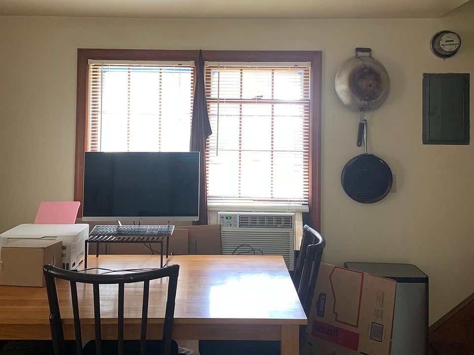 This is the seating/eating area of the main floor. This is an open floor plan. These windows are on the left hand side when you walk into the house, and they face south.