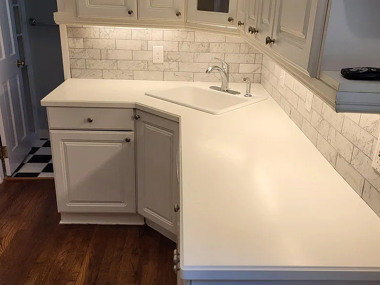 New marble backspash, under cabinete lighting, plenty of cabinets