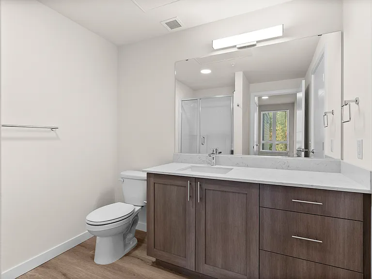 Spacious bathroom with sleek finishes. Spacious bathroom with sleek finishes.