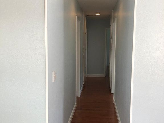 Hallway looking from living room area to bedrooms