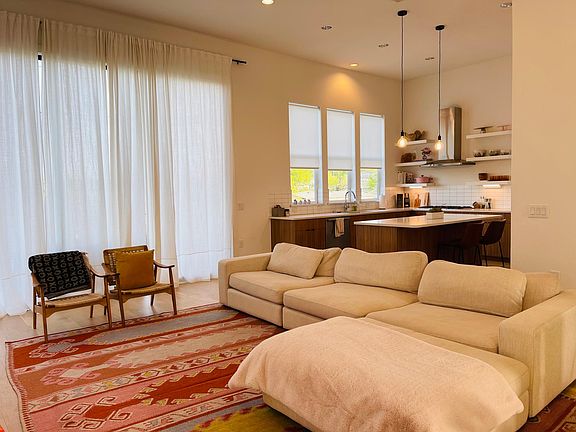 Living Room (+ Kitchen) - 10ft 3-panel Sliding Glass Door to Backyard behind curtain