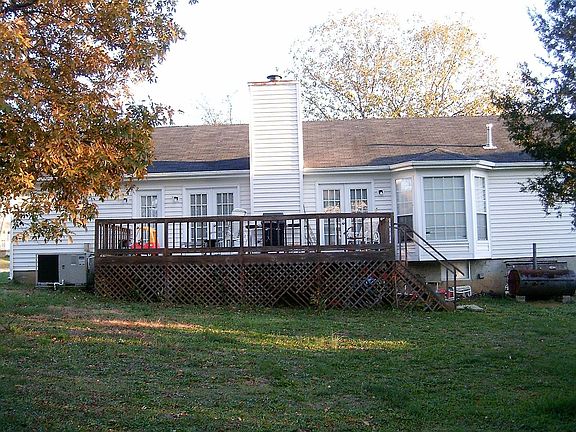 Large Back Porch with two French Doors Leading into the house.