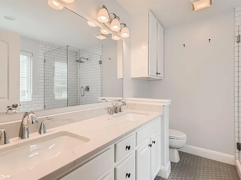 Fully updated master bathroom. Double sinks, soaker tub, and glass enclosed shower