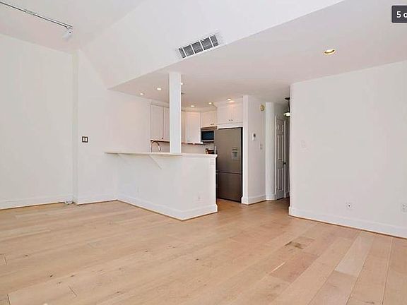 Open floor plan, bar, kitchen.