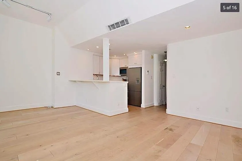 Open floor plan, bar, kitchen.