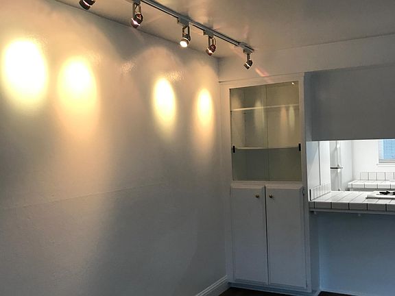 Track light. Nich with glass doors