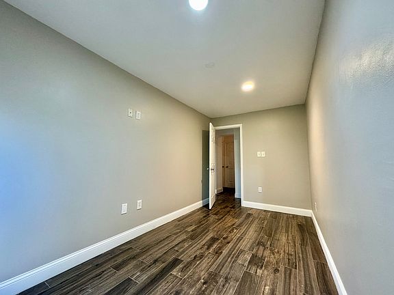 Family room with walk-out basement. Sliding glass door lets in plenty of light. Dimensions: 15' x 7'