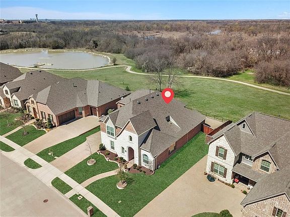 A RARE FIND BACKING TO COVETED CORP PROPERTY WITH AMAZING VIEWS OF THE WOODS AND POND!