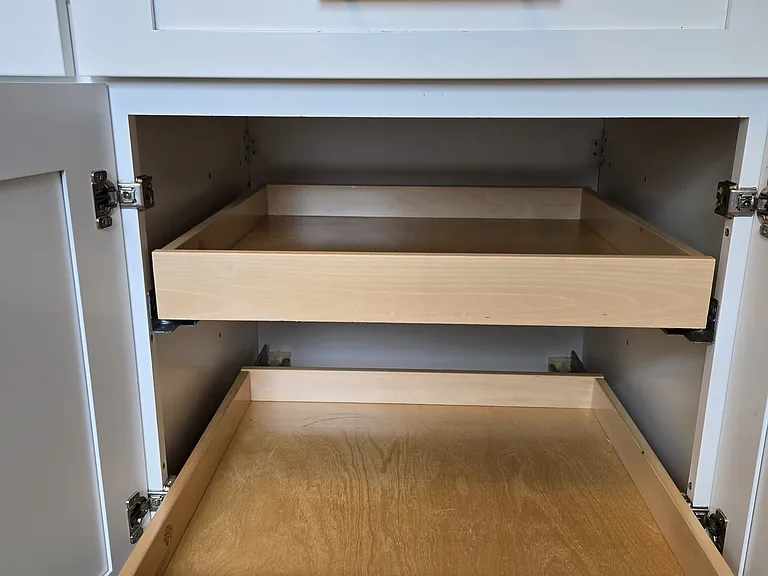 Shaker cabinetry with soft-close doors and pull-out shelves