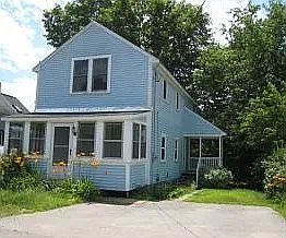 Front of the house showing driveway and parking spaces