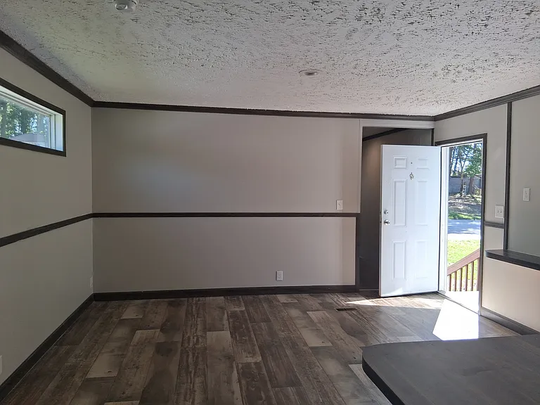 Open concept makes the living room and kitchen feel like one grand space with a modern concept.