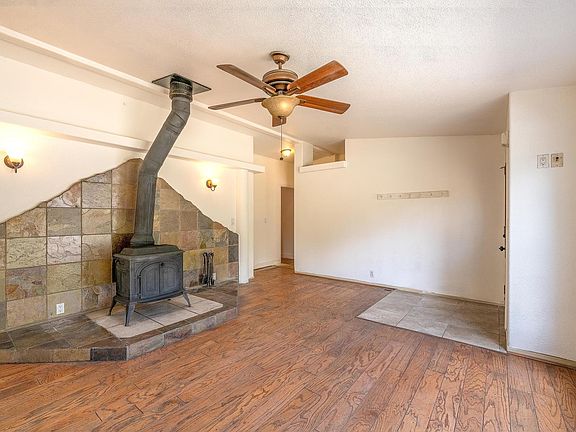 Living room w/wood-burning stove for chilly Rocky Mountain evenings