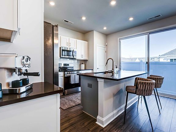 Discover the joy of spacious cooking in our cottage kitchens. Ample counter space awaits on your quartz countertops.