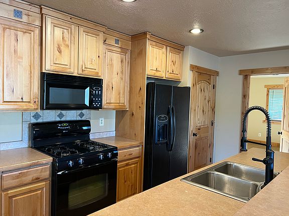 Full kitchen includes newer fridge, dishwasher and stove/microwave with lots of storage and cabinets - 1 pantry and 1 extra closet