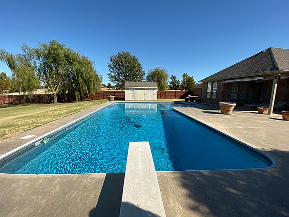 pool with storage building