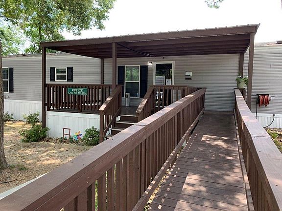 This is our leasing and sales office. We have full time office and maintenance staff to better serve you. Come by or call to set up a appointment for a home viewing.