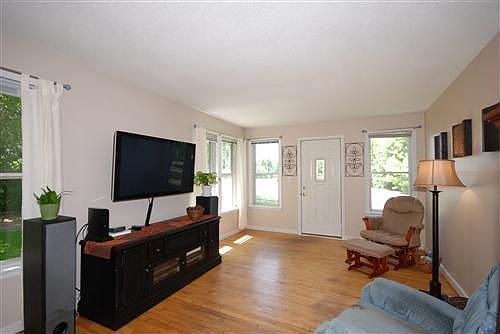 The spacious living room features hardwood floors.